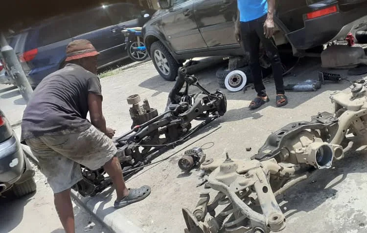 ONYEBEST technicians stripping down a Volvo rear axle outside the workshop at Ladipo Volvo Plaza, Mushin, Lagos